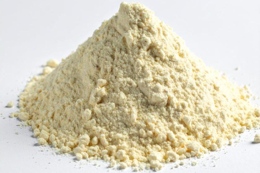 Pile of light-colored powder on a white background, representing the Biotin added to the Move Blend Supplement